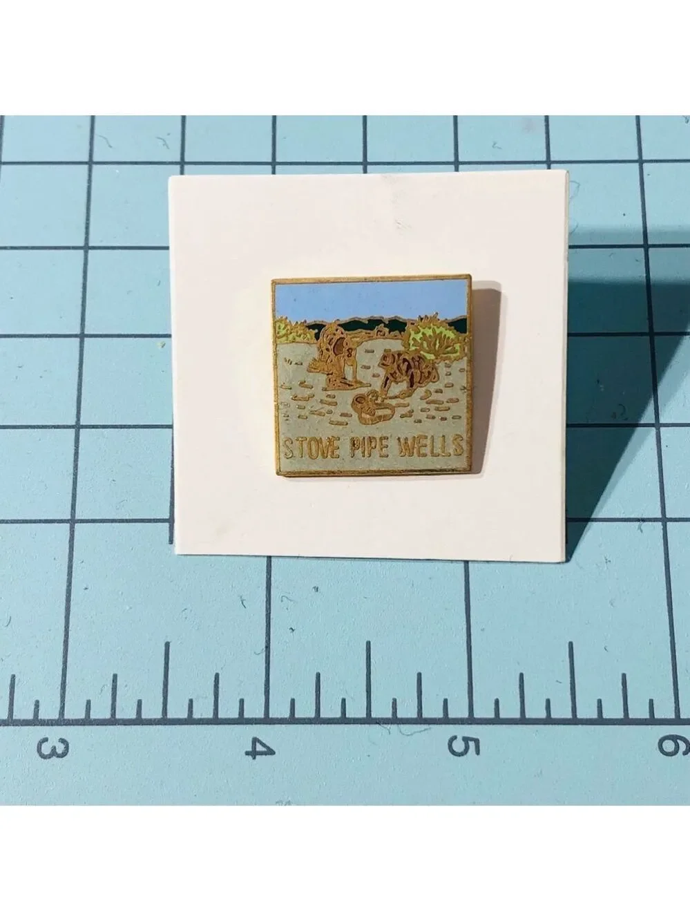 Stove Pipe Wells Landscape Enamel Lapel Pin Gold Tone